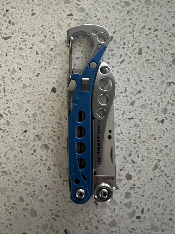 Blue Leatherman Style CS in the closed position with the carabiner upward
