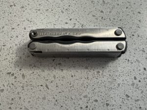 Retired Leatherman Kick in its closed position. Stainless steel in color.