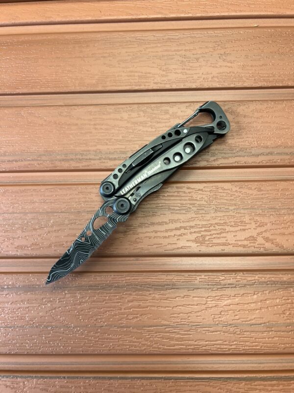 Black Skeletool Leatherman with Topographical Printed blade