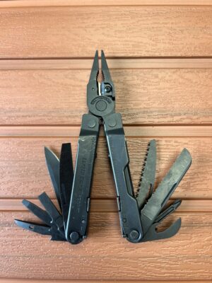 Leatherman Rebar - Black Oxide withe the pliers open and the tools on both handles fanned open