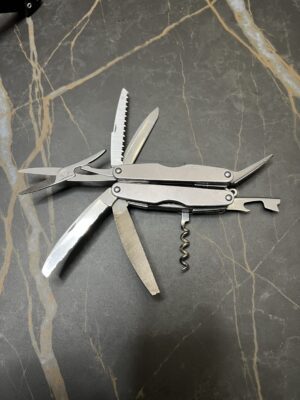 Gray Leatherman Juice XE6 with tools fanned open
