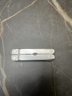 Stainless Steel Leatherman Super Tool in the closed position