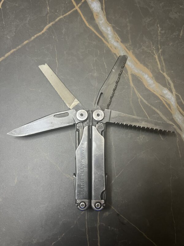 Black Oxide Leatherman Wave+ in closed position with the outer tools fanned open
